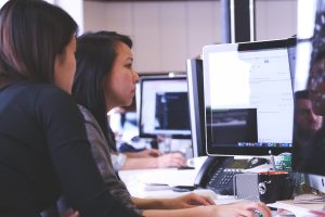 employees infront of desktop